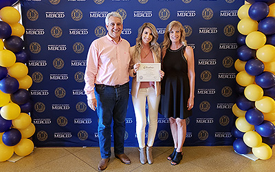 Andrade was named a Chancellor's Scholar for her exemplary work in the classroom and her parents were right by her side.